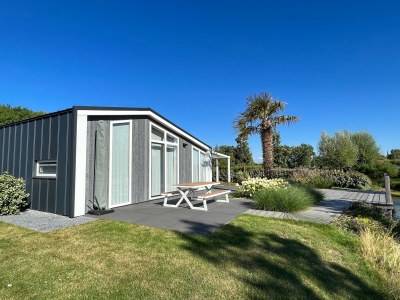 Holiday park Holiday Home in Zeeland with Streamside Terrace - Outdoor photo 7