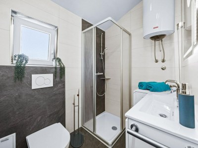 Apartment Familienfreundliches Apartment mit Meerblick - Features photo 10