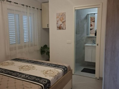Apartment Apartment Jakić - One Bedroom Apartment with Garden View - Features photo 8
