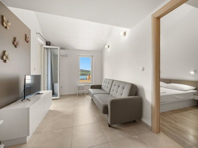 Apartment Bezauberndes Sommerapartment mit Meerblick - Features photo 16