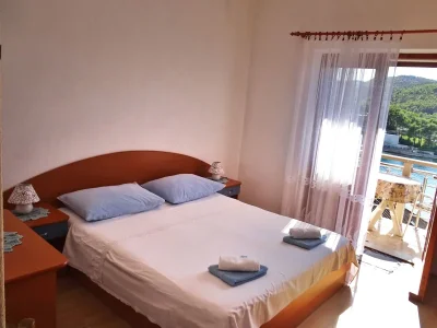 Apartment Two bedroom apartment with balcony and sea view Povlja, Brač A-14399-c in Povlja - Apartment
