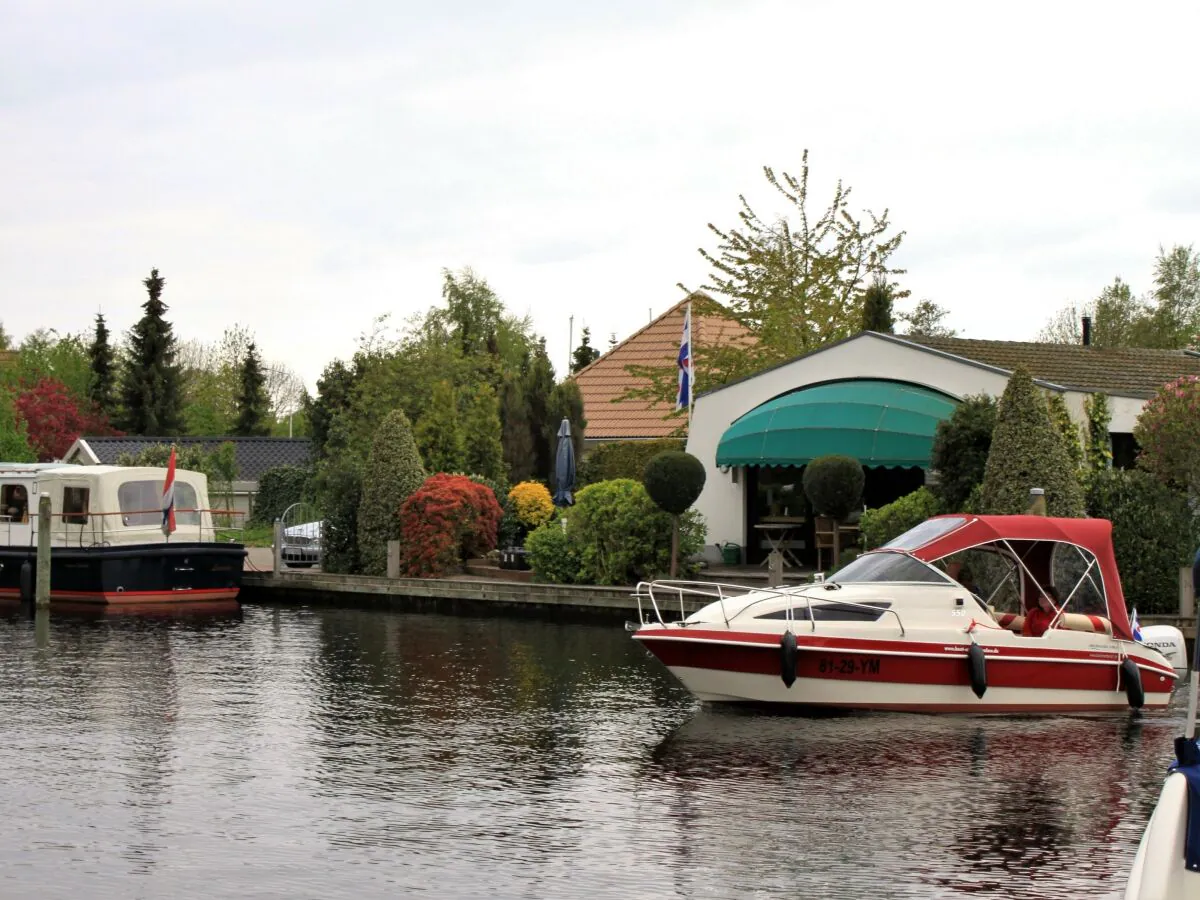 Holiday house with boat and own landing stage