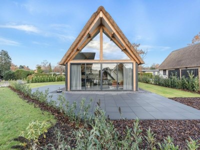 Holiday park Modern bungalow in Baarle-Nassau with pond view - Holiday park