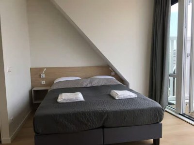 Apartment 2-person lodge on 2nd floor with view of dunes. - Features photo 12