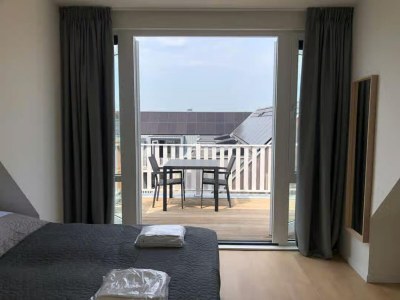Apartment 2-person lodge on 2nd floor with view of dunes. - Features photo 14