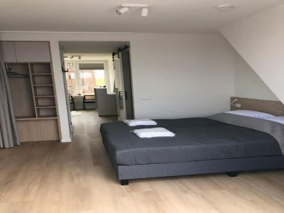Apartment 2-person lodge on 2nd floor with view of dunes. - Features photo 16