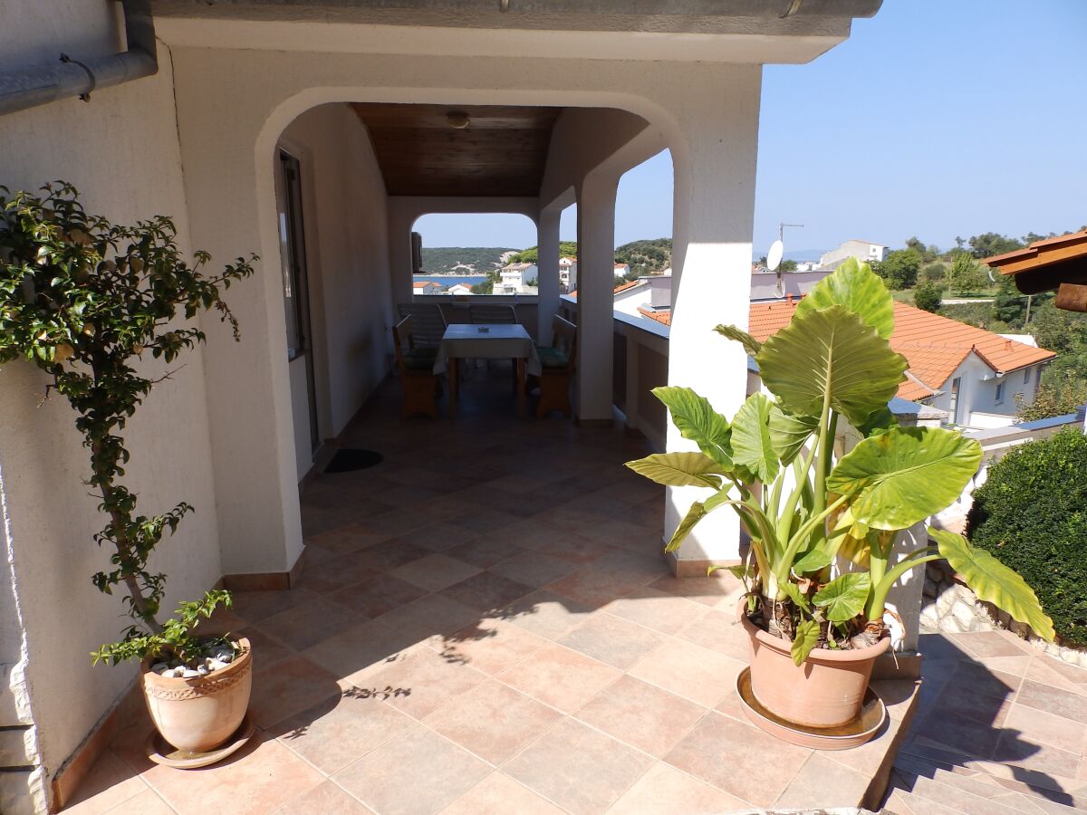 Apartment Two bedroom apartment with terrace and sea view Kampor, Rab A-12273-a